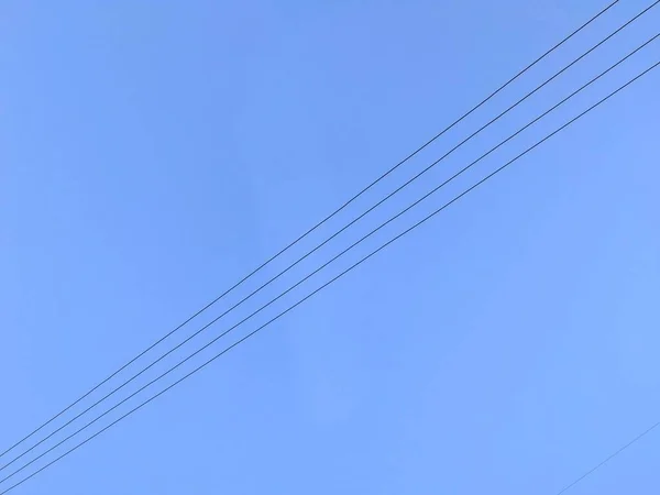 high voltage wires on the sky