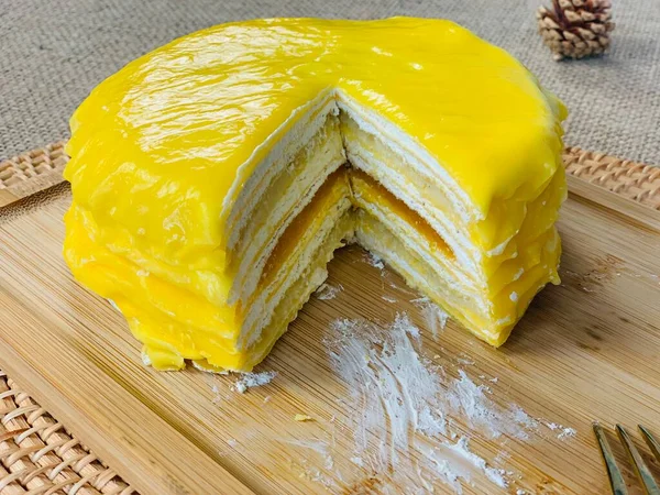 yellow lemon cake on a wooden board