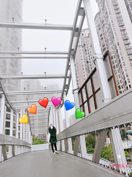 young couple in love with heart shaped balloons