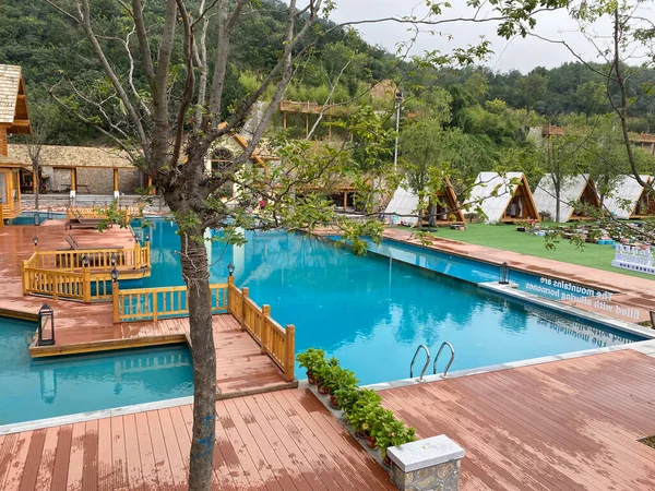 swimming pool with water and wooden floor