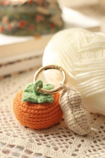 knitted socks and knitting needles on a wooden background