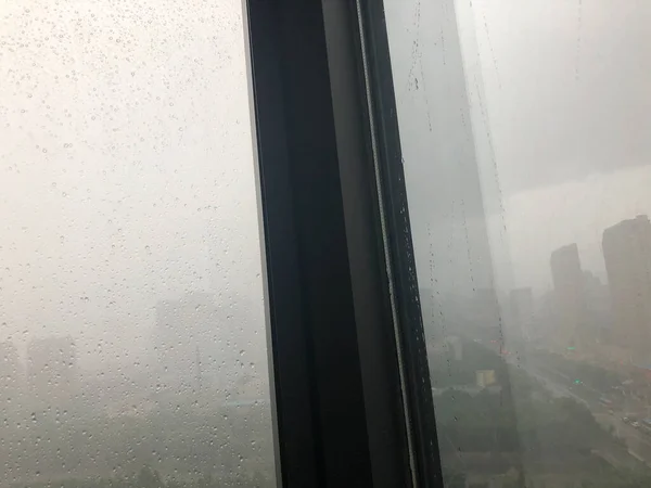 window with glass windows and rain drops