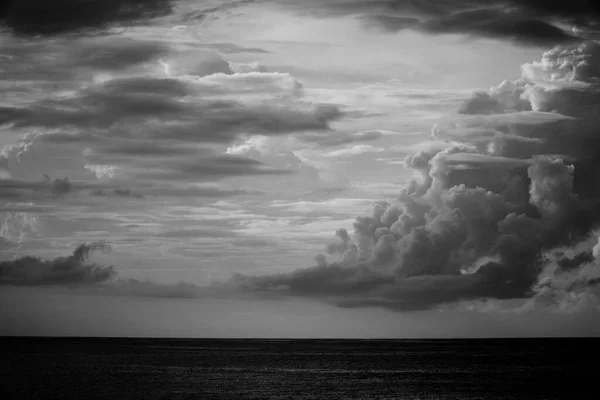 black and white clouds on the sea