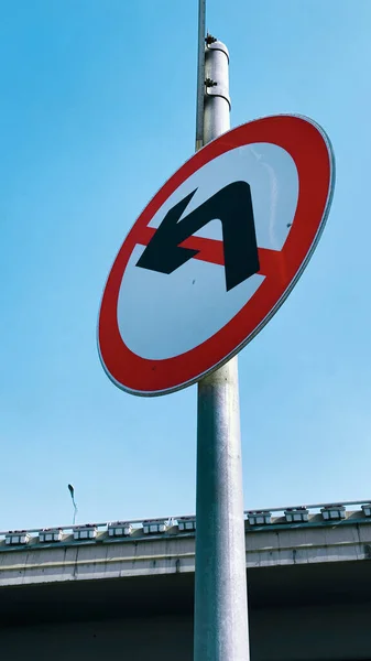 red and white traffic signs on a blue sky background