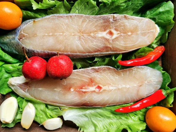 fresh fish with vegetables and herbs