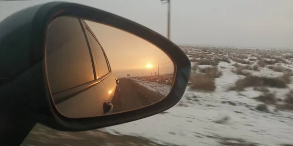 car driving through the window of the sun