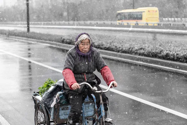 young woman riding a motorcycle in the rain