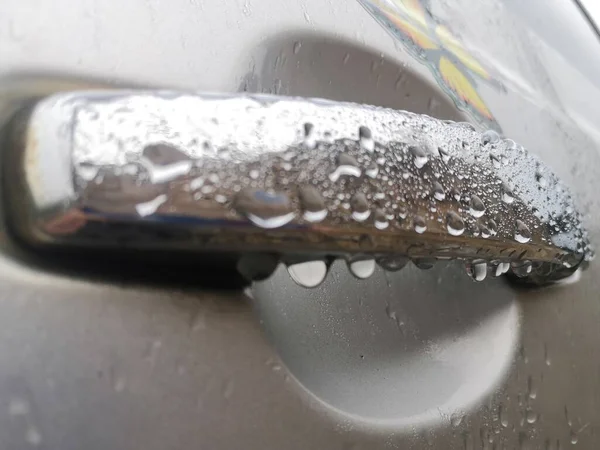 washing car with foam and water drops