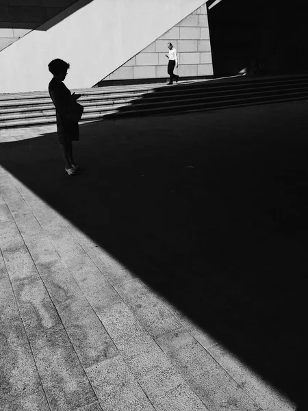 silhouette of a man walking on the street