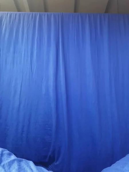white curtain with blue curtains