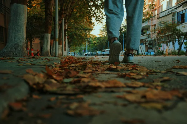 young man walking on the street