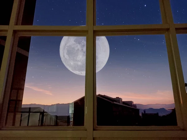 night view of the window of the house in the city