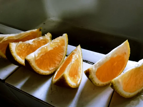 fresh sliced orange and lemon slices on a white background