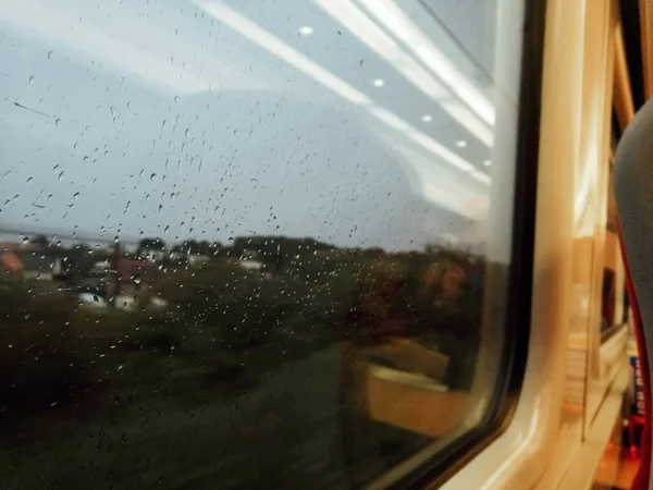 car window with rain drops