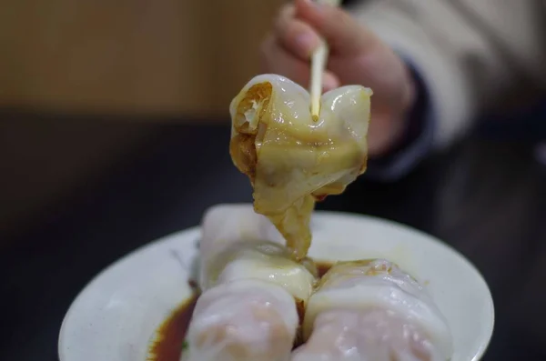 a closeup shot of a chef making a food