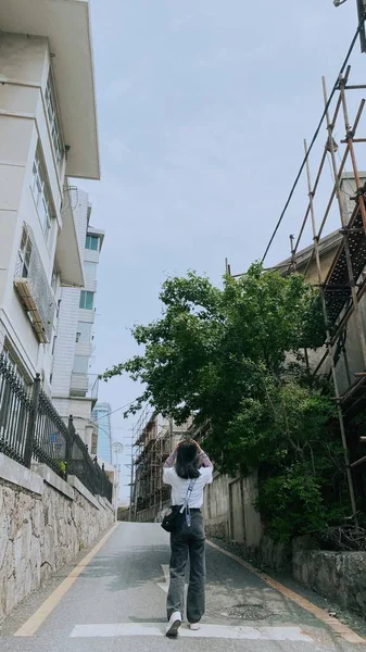 young man in a suit walking in the city