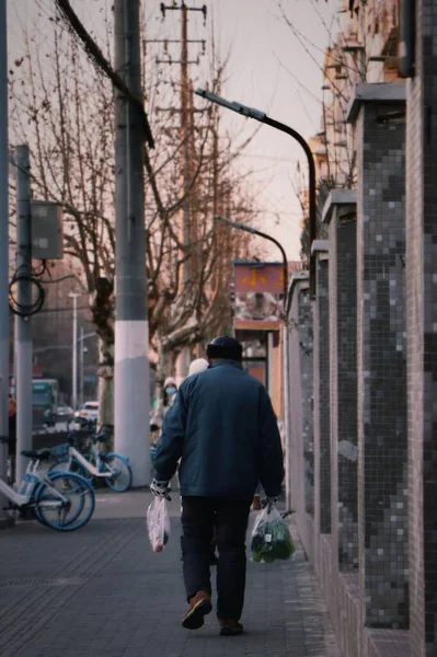 young man in a suit walking in the city