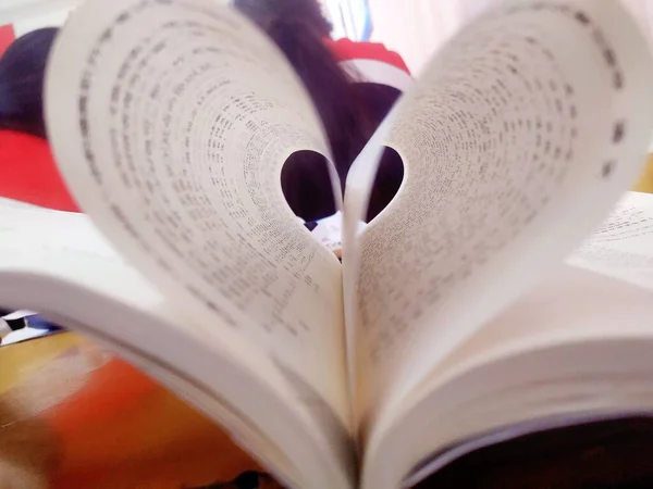book with a heart and a pen