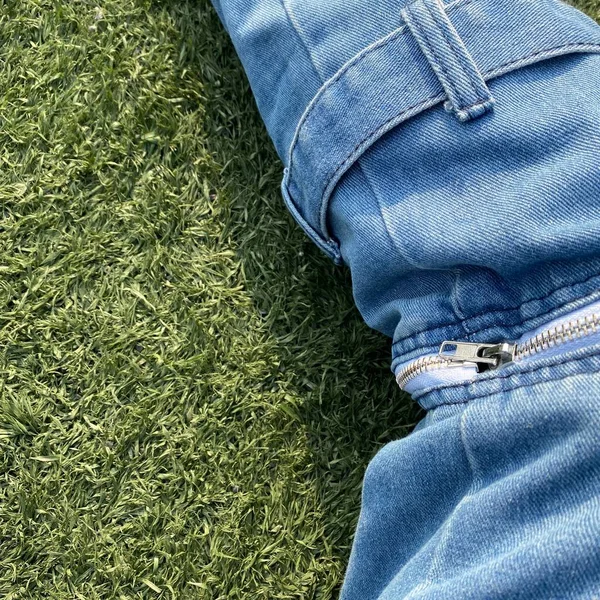 jeans on green background