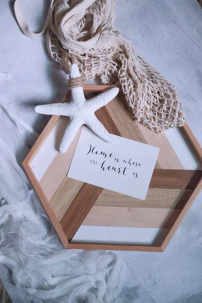 christmas card with white angel and gift box on wooden background