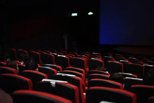 empty cinema hall with red seats and chairs