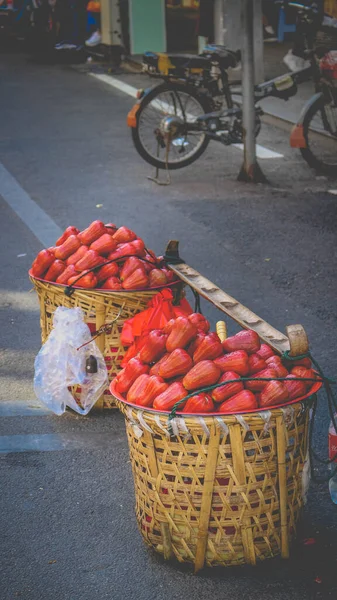 basket with fruits and vegetables on the street