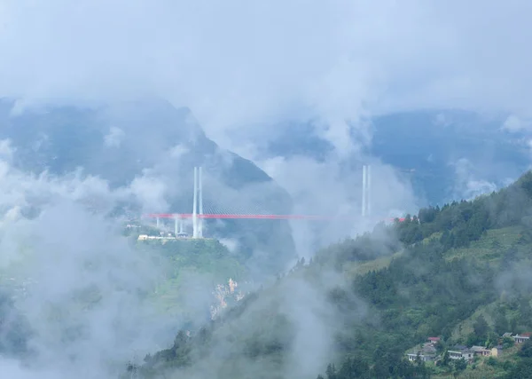 view of the mountains in the fog