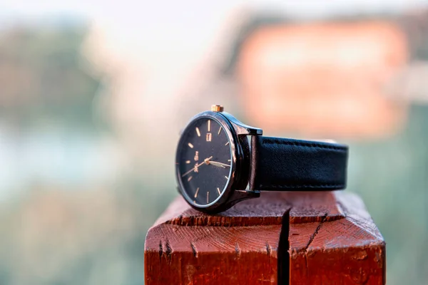 vintage watch on the background of the old wooden table