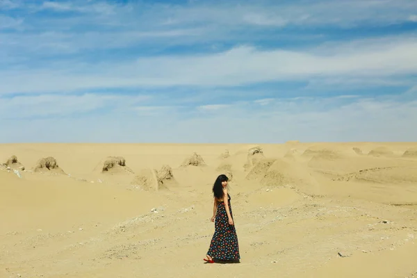 young woman in a desert