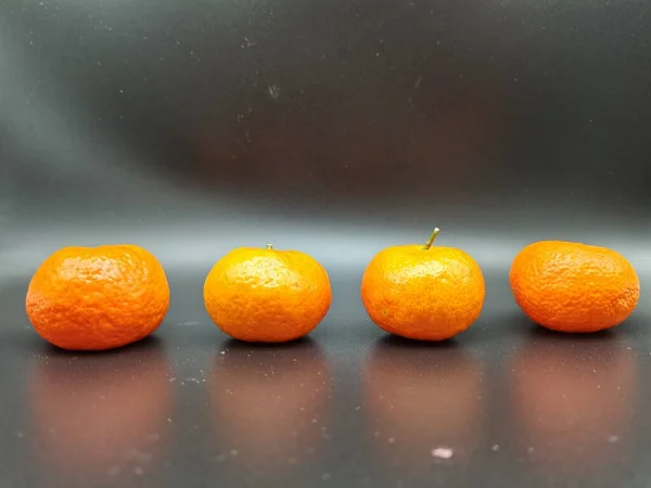 fresh ripe orange on a black background