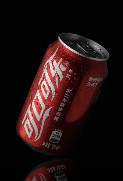 red beer can with a black background