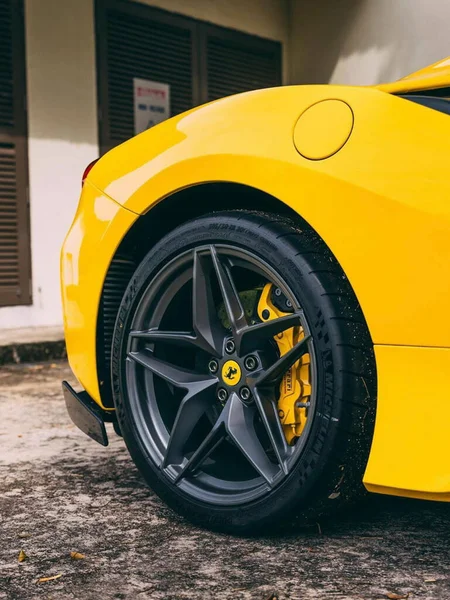 yellow car wheel with a white background