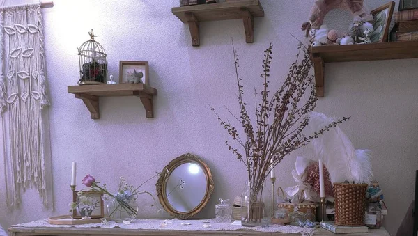 interior of a room with a candle and a vase