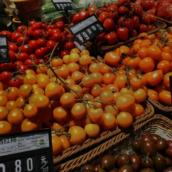 fresh tomatoes on a market stall