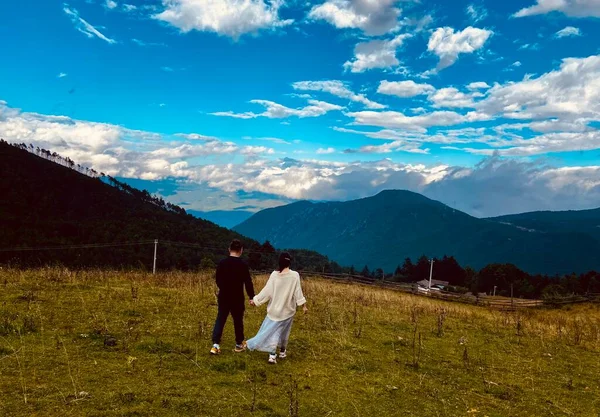 young couple in love on the mountain