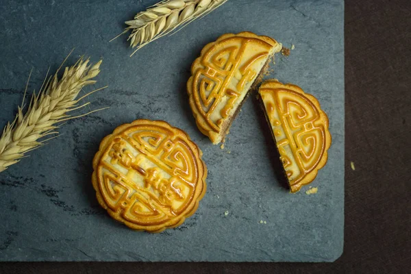 traditional chinese festival moon cake with yellow and white background