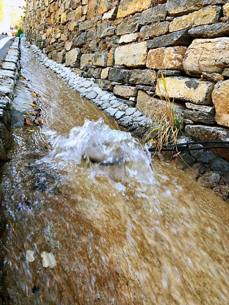 old stone wall with water drops