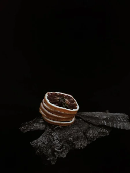 a closeup shot of a brown and black chocolate on a dark background