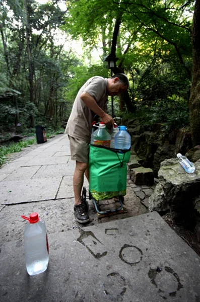 man and woman cleaning the garbage in the park