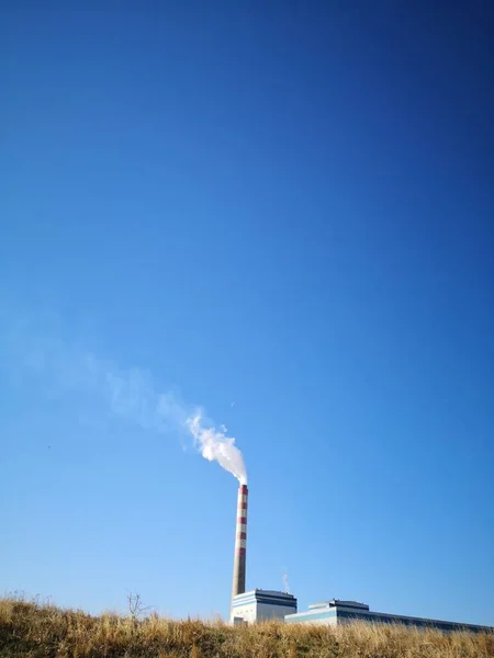 industrial factory chimney and blue sky