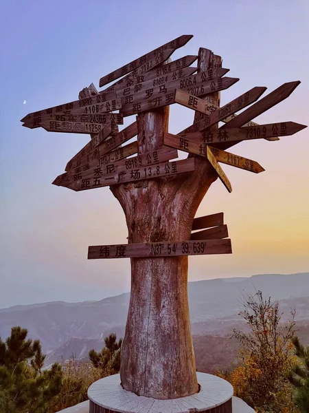 wooden signpost in the mountains