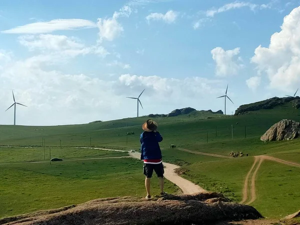 young woman with wind turbine