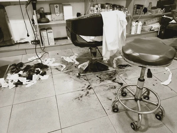 black and white photo of a barber chair