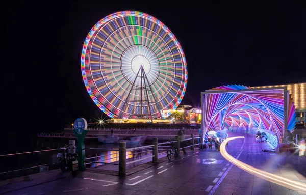 ferris wheel in amusement park, london, uk