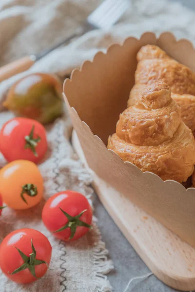 homemade tomato pie with cheese and tomatoes on a wooden board