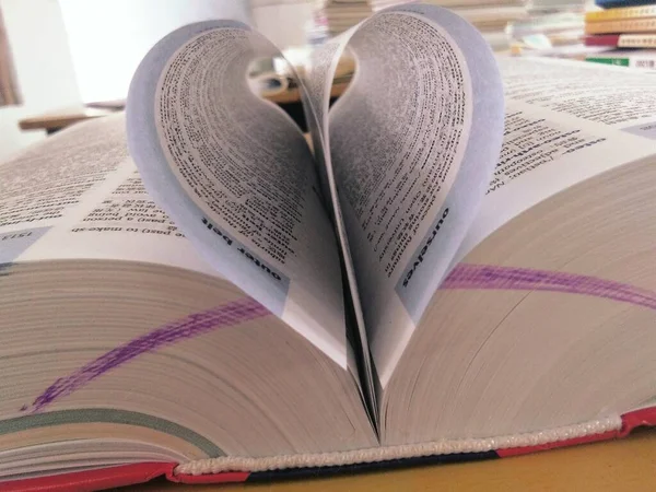 book and heart on the table
