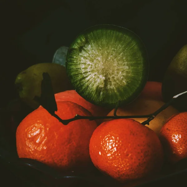fresh fruits and vegetables on a black background