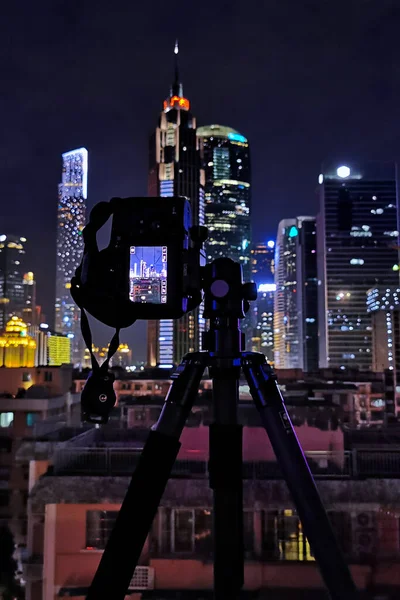 silhouette of a modern building with a camera