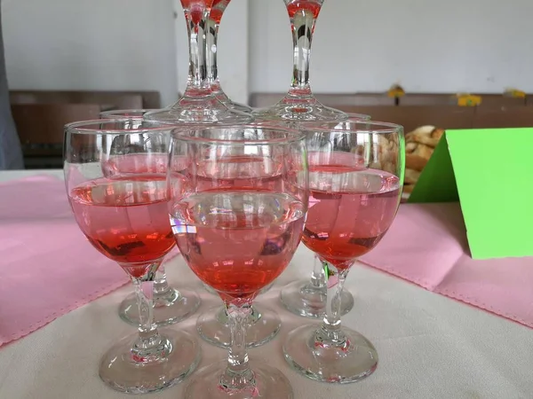glasses of red wine on a table
