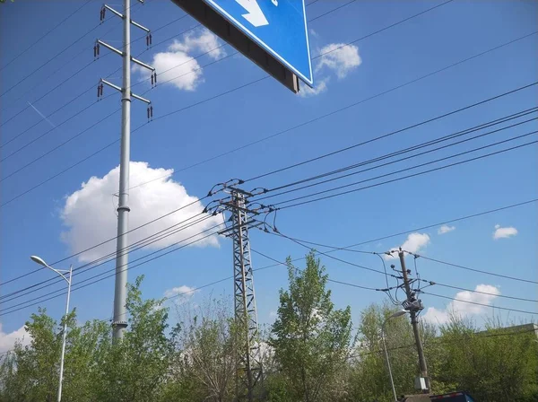 high voltage power line on the background of the blue sky